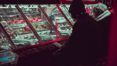 Man deeply engrossed in gambling, surrounded by casino elements