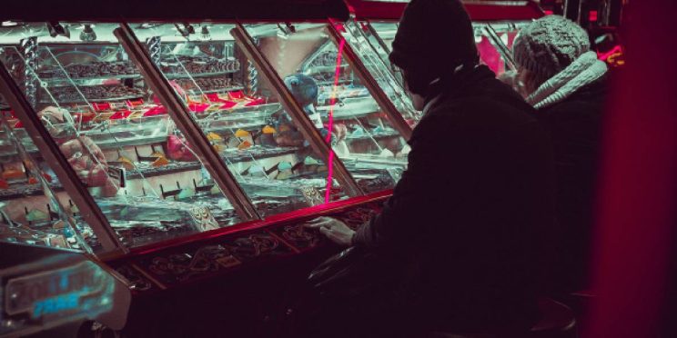 Man deeply engrossed in gambling, surrounded by casino elements