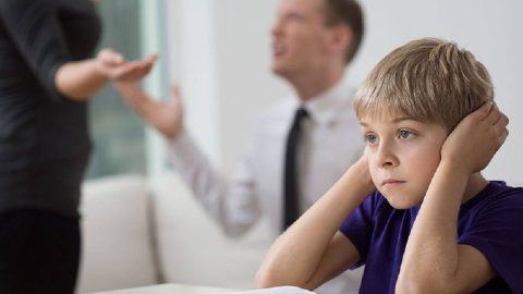 A distressed child caught in the middle of arguing parents, extramarital affairs being the source of the dispute.