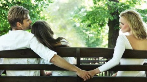 Man engaging in an intimate conversation with a friend, hinting at emotional cheating.