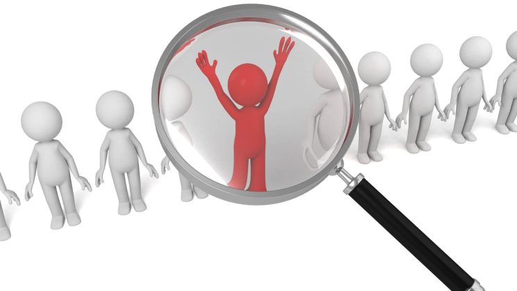 Investigator analyzing public records and databases for a skip tracing case