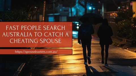 Couple walking at night under an umbrella