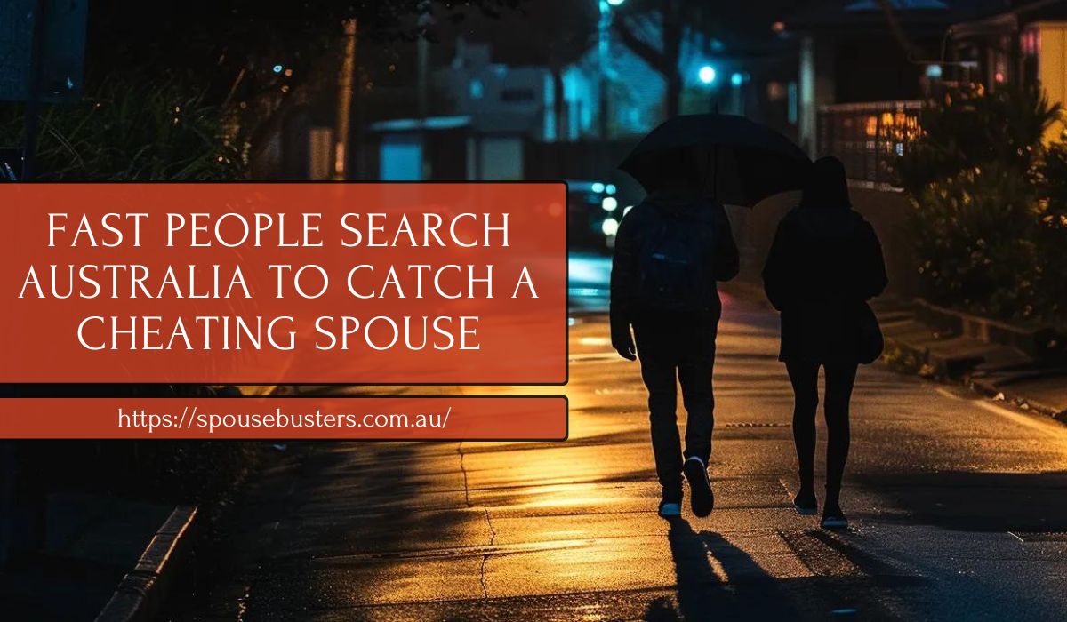 Couple walking at night under an umbrella