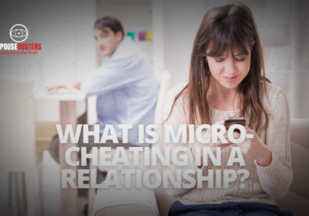 Woman texting on her phone while a man in the background looks on with concern